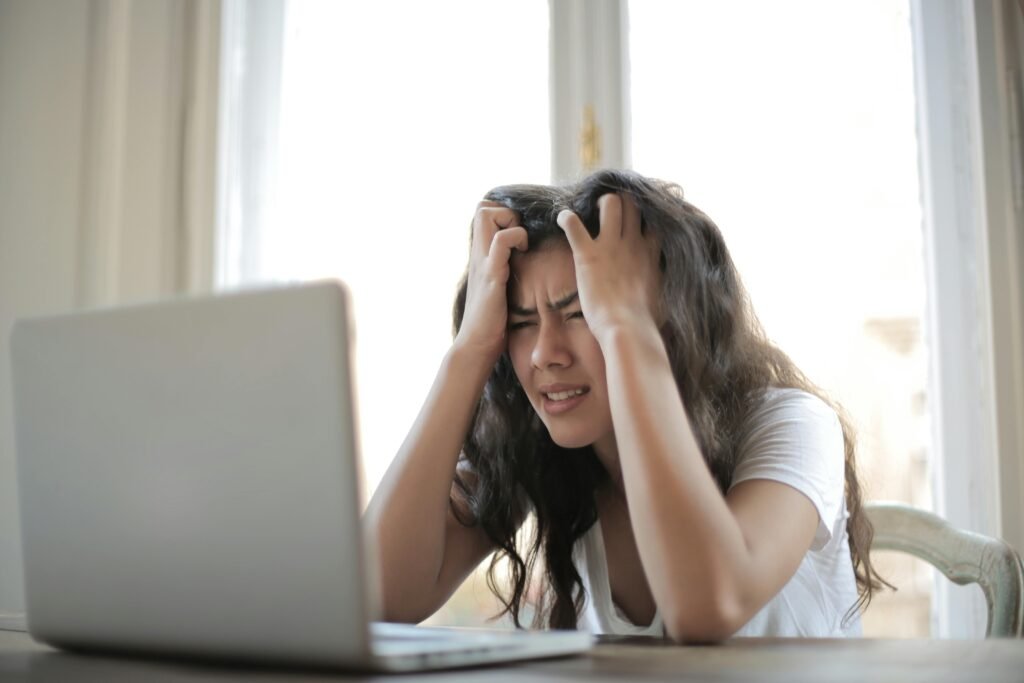 Frustrated woman struggling with finances.